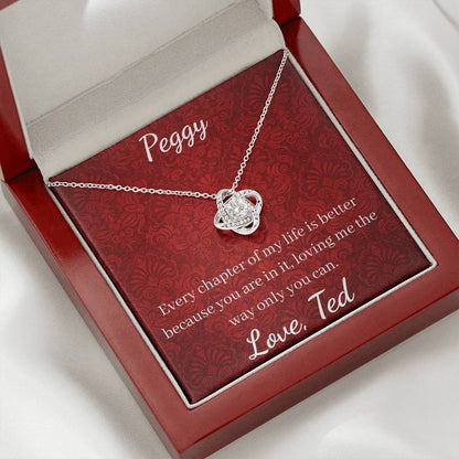 Silver necklace on a red card with personalized message in an open jewelry box